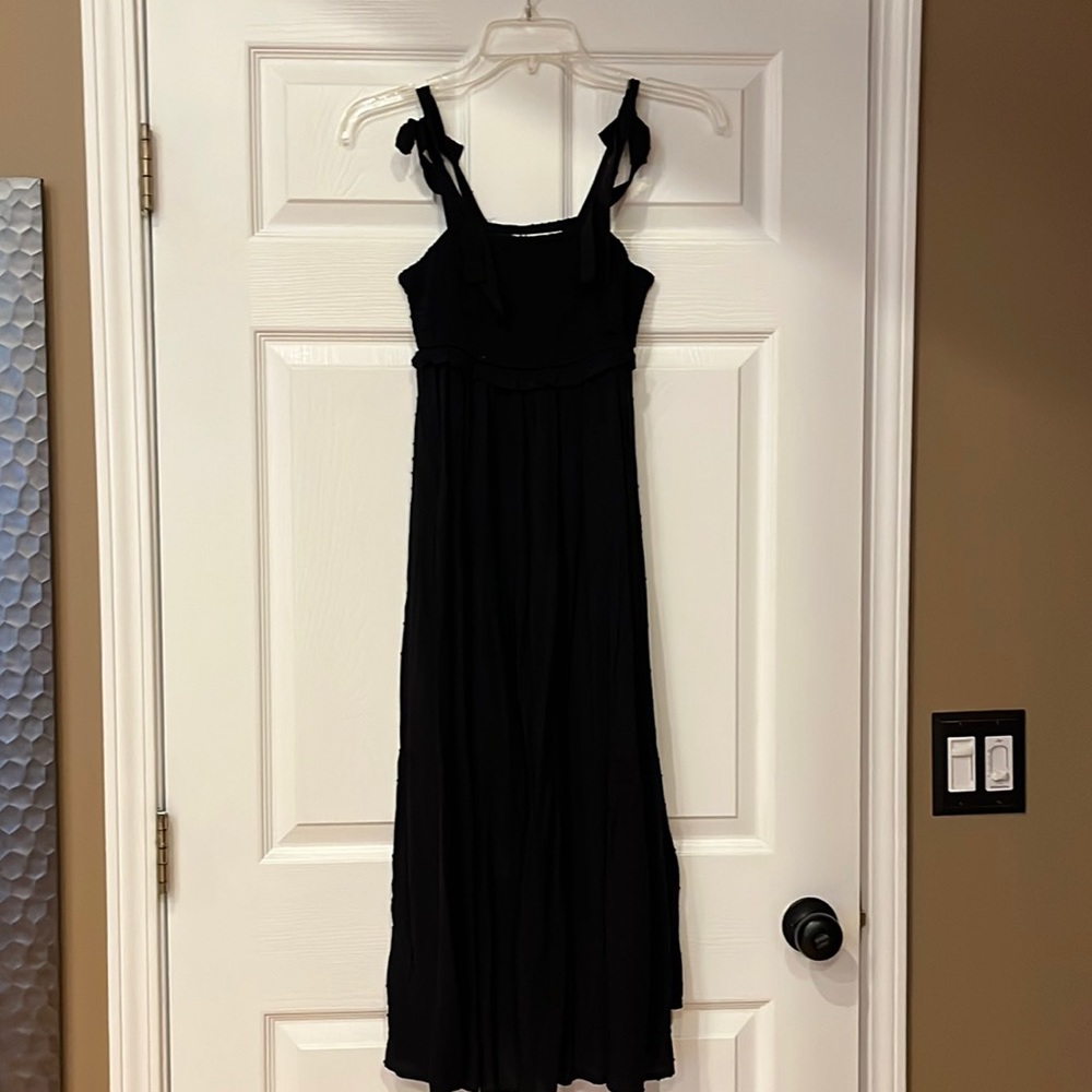 Black dress with ribbons for straps with a polka dot pattern